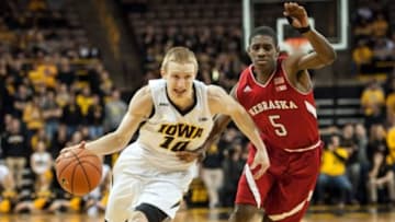 Jan 5, 2016; Iowa City, IA, USA; Iowa Hawkeyes guard Mike Gesell (10) goes to the basket as Nebraska Cornhuskers guard Glynn Watson Jr. (5) defends during the second half at Carver-Hawkeye Arena. Iowa won 77-66. Mandatory Credit: Jeffrey Becker-USA TODAY Sports