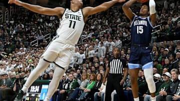 Nov 18, 2022; East Lansing, Michigan, USA; Villanova Wildcats guard Jordan Longino (15) shoots past Michigan State Spartans guard A.J. Hoggard (11) at Jack Breslin Student Events Center. Mandatory Credit: Dale Young-USA TODAY Sports