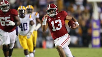 BATON ROUGE, LA - NOVEMBER 03: Tua Tagovailoa #13 of the Alabama Crimson Tide runs for a third quarter touchdown while playing the LSU Tigers at Tiger Stadium on November 3, 2018 in Baton Rouge, Louisiana. Alabama won the game 29-0. (Photo by Gregory Shamus/Getty Images)