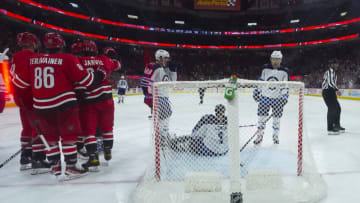 Apr 21, 2022; Raleigh, North Carolina, USA; Carolina Hurricanes center Seth Jarvis (24) is congratulated by left wing Teuvo Teravainen (86) after scoring a goal past Winnipeg Jets goaltender Eric Comrie (1) during the third period at PNC Arena. Mandatory Credit: James Guillory-USA TODAY Sports