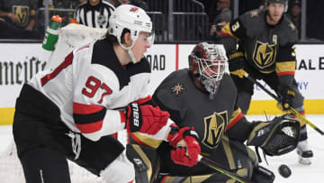 LAS VEGAS, NEVADA - MARCH 03: Robin Lehner #90 of the Vegas Golden Knights makes a save against as Nikita Gusev #97 of the New Jersey Devils looks for a rebound in the third period of their game at T-Mobile Arena on March 3, 2020 in Las Vegas, Nevada. The Golden Knights defeated the Devils 3-0. (Photo by Ethan Miller/Getty Images)