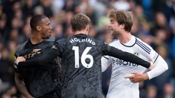 LEEDS, ENGLAND - OCTOBER 16: Rob Holding of Arsenal holds back team mate Gabriel Magalhaes and Patrick Bamford of Leeds United during the Premier League match between Leeds United and Arsenal FC at Elland Road on October 16, 2022 in Leeds, United Kingdom. (Photo by Joe Prior/Visionhaus via Getty Images)
