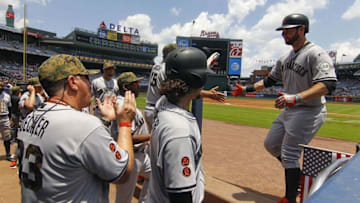 May 30, 2016; Atlanta, GA, USA; San Francisco Giants first baseman Brandon Belt (9) celebrates with teammates in the dugout after hitting a home run against the Atlanta Braves in the second inning at Turner Field. The Braves won 5-3. Mandatory Credit: Brett Davis-USA TODAY Sports
