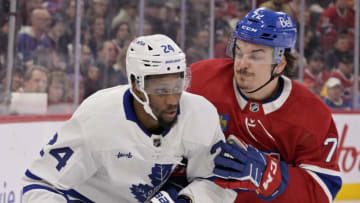 Jan 21, 2023; Montreal, Quebec, CAN; Toronto Maple Leafs forward Wayne Simmonds (24) and Montreal Canadiens defenseman Arber Xhekaj (72) battle for the puck during the first period at the Bell Centre. Mandatory Credit: Eric Bolte-USA TODAY Sports