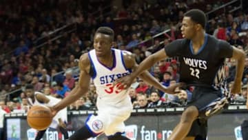 Jan 30, 2015; Philadelphia, PA, USA; Philadelphia 76ers forward Jerami Grant (39) drives past Minnesota Timberwolves forward Andrew Wiggins (22) during the second half at Wells Fargo Center. The 76ers defeated the Timberwolves 103-94. Mandatory Credit: Bill Streicher-USA TODAY Sports