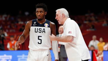 BEIJING, CHINA - SEPTEMBER 14: Coach Gregg Popovich of USA speaks to Donovan Mitchell #5 during FIBA World Cup 2019 Games 7-8 match between the United States and Poland at Cadillac Arena on September 14, 2019 in Beijing, China. (Photo by VCG/VCG via Getty Images)
