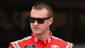 FONTANA, CA - MARCH 16: Ryan Preece, driver of the #18 Rheem Toyota, stands in the garage during practice for the NASCAR Xfinity Series Roseanne 300 at Auto Club Speedway on March 16, 2018 in Fontana, California. (Photo by Josh Hedges/Getty Images)