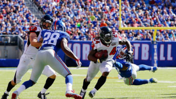 EAST RUTHERFORD, NJ - SEPTEMBER 20: (NEW YORK DAILIES OUT) Devonta Freeman #24 of the Atlanta Falcons in action against Trumaine McBride #38 of the New York Giants on September 20, 2015 at MetLife Stadium in East Rutherford, New Jersey. The Falcons defeated the Giants 24-20. (Photo by Jim McIsaac/Getty Images)