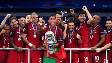 PARIS, FRANCE - JULY 10: Cristiano Ronaldo of Portugal (c) lifts the Henri Delaunay trophy after his side win 1-0 against France during the UEFA EURO 2016 Final match between Portugal and France at Stade de France on July 10, 2016 in Paris, France. (Photo by Mike Hewitt/Getty Images)