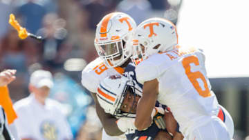 AUBURN, AL - OCTOBER 13: Linebacker Darrell Taylor #19 of the Tennessee Volunteers and defensive back Alontae Taylor #6 of the Tennessee Volunteers tackle running back Malik Miller #32 of the Auburn Tigers during the third quarter at Jordan-Hare Stadium on October 13, 2018 in Auburn, Alabama. (Photo by Michael Chang/Getty Images)