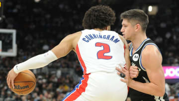 Milwaukee Bucks guard Grayson Allen (right) plays defense against Detroit Pistons guard Cade Cunningham Credit: Michael McLoone-USA TODAY Sports