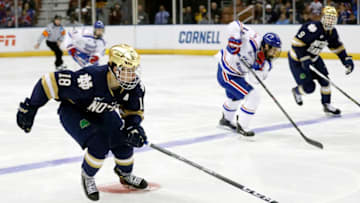 MANCHESTER, NH - MARCH 26: Notre Dame Fighting Irish center Jake Evans (18) skates the puck through the neutral zone during the NCAA Northeast Regional final between the UMass Lowell River Hawks and the Notre Dame Fighting Irish on March 26, 2017, at SNHU Arena in Manchester, New Hampshire. The Fighting Irish defeated the River Hawks 3-2 (OT). (Photo by Fred Kfoury III/Icon Sportswire via Getty Images)