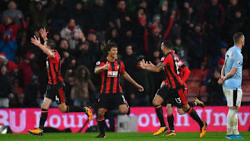 BOURNEMOUTH, ENGLAND - DECEMBER 26: Callum Wilson of AFC Bournemouth celebrates with team mates Nathan Ake and Dan Gosling after scoring their sides third goal during the Premier League match between AFC Bournemouth and West Ham United at Vitality Stadium on December 26, 2017 in Bournemouth, England. (Photo by Dan Mullan/Getty Images)