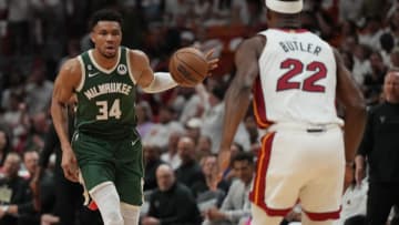 Apr 24, 2023; Miami, Florida, USA; Milwaukee Bucks forward Giannis Antetokounmpo (34) brings the ball up the court as Miami Heat forward Jimmy Butler (22) defends in the first quarter during game four of the 2023 NBA Playoffs at Kaseya Center. Mandatory Credit: Jim Rassol-USA TODAY Sports