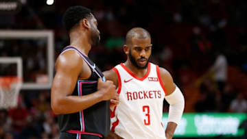 Dwyane Wade #3 of the Miami Heat and Chris Paul #3 of the Houston Rockets look on during the first half at American Airlines Arena (Photo by Michael Reaves/Getty Images)