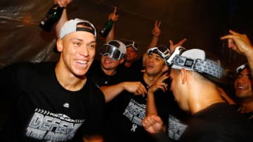 NEW YORK, NY - SEPTEMBER 22: Aaron Judge #99, Luke Voit #45 and Gary Sanchez #24 of the New York Yankees celebrates clinching a playoff spot after defeating the Baltimore Orioles 3-2 in eleventh inning at Yankee Stadium on September 22, 2018 in the Bronx borough of New York City. (Photo by Mike Stobe/Getty Images)