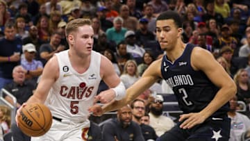 Apr 6, 2023; Orlando, Florida, USA; Cleveland Cavaliers guard Sam Merrill (5) moves to the basket against Orlando Magic guard Caleb Houstan (2) during the second quarter at Amway Center. Mandatory Credit: Mike Watters-USA TODAY Sports