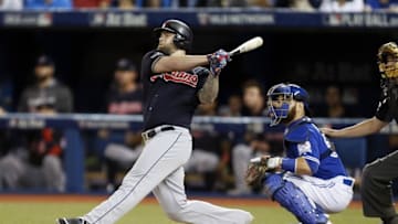 Oct 19, 2016; Toronto, Ontario, CAN; Cleveland Indians designated hitter Mike Napoli (26) hits a RBI double during the first inning against the Toronto Blue Jays in game five of the 2016 ALCS playoff baseball series at Rogers Centre. Mandatory Credit: John E. Sokolowski-USA TODAY Sports