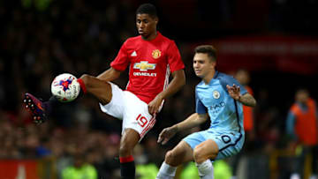 MANCHESTER, ENGLAND - OCTOBER 26: Marcus Rashford of Manchester United (L) controls the ball while being put under pressure from Pablo Maffeo of Manchester City (R) during the EFL Cup fourth round match between Manchester United and Manchester City at Old Trafford on October 26, 2016 in Manchester, England. (Photo by Michael Steele/Getty Images)
