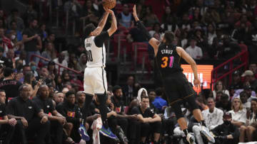 MIAMI, FLORIDA - MARCH 26: Seth Curry #30 of the Brooklyn Nets shoots a jump shot over Max Strus #31 of the Miami Heat during the second half at FTX Arena on March 26, 2022 in Miami, Florida. NOTE TO USER: User expressly acknowledges and agrees that, by downloading and or using this photograph, User is consenting to the terms and conditions of the Getty Images License Agreement. (Photo by Eric Espada/Getty Images) (Photo by Eric Espada/Getty Images)