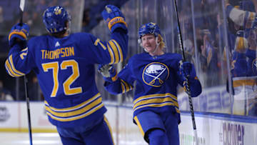 Nov 6, 2021; Buffalo, New York, USA; Buffalo Sabres defenseman Rasmus Dahlin (26) celebrates his goal with right wing Tage Thompson (72) during the second period against the Detroit Red Wings at KeyBank Center. Mandatory Credit: Timothy T. Ludwig-USA TODAY Sports