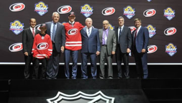 Jun 26, 2015; Sunrise, FL, USA; Noah Hanifin poses for a photo with team executives after being selected as the number five overall pick to the Carolina Hurricanes in the first round of the 2015 NHL Draft at BB&T Center. Mandatory Credit: Steve Mitchell-USA TODAY Sports