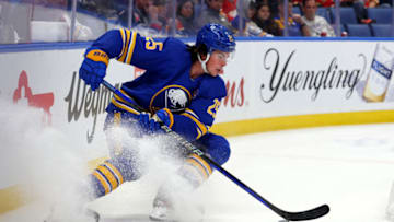 Oct 19, 2023; Buffalo, New York, USA; Buffalo Sabres defenseman Owen Power (25) looks to control the puck during the third period against the Calgary Flames at KeyBank Center. Mandatory Credit: Timothy T. Ludwig-USA TODAY Sports