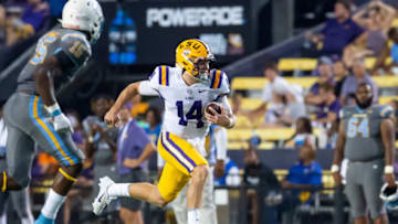 Sep 10, 2022; Baton Rouge, Louisiana, USA; LSU Tigers quarterback Walker Howard (14) runs the ball against the Southern Jaguars during the second half at Tiger Stadium. Mandatory Credit: Scott Clause-USA TODAY Sports