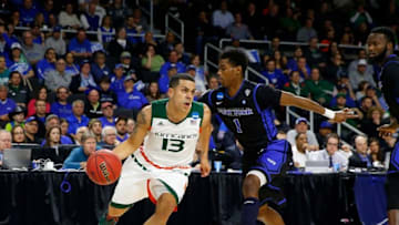 Mar 17, 2016; Providence, RI, USA; Miami (Fl) Hurricanes guard Angel Rodriguez (13) drives past Buffalo Bulls guard Lamonte Bearden (1) during the first half of a first round game of the 2016 NCAA Tournament at Dunkin Donuts Center. Mandatory Credit: Winslow Townson-USA TODAY Sports