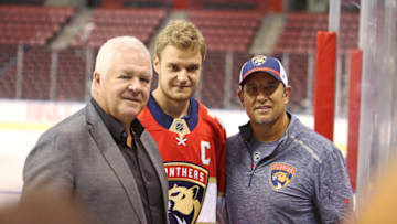 Aleksander Barkov was named as captain of the Florida Panthers on Monday, Sept. 17, 2018. Barkov, middle, with Panthers general manager Dale Tallon, left, and head coach Bob Boughner after the annoucement at the BB&T Center in Sunrise, Fla. (Emily Michot/Miami Herald/TNS via Getty Images)