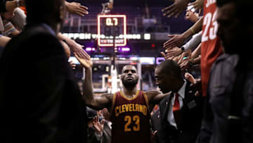PHOENIX, AZ - JANUARY 08: LeBron James #23 of the Cleveland Cavaliers high fives fans following the NBA game against the Phoenix Suns at Talking Stick Resort Arena on January 8, 2017 in Phoenix, Arizona. The Cavaliers defeated the Suns 120-116. NOTE TO USER: User expressly acknowledges and agrees that, by downloading and or using this photograph, User is consenting to the terms and conditions of the Getty Images License Agreement. (Photo by Christian Petersen/Getty Images)