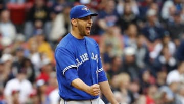 Jun 5, 2016; Boston, MA, USA; Toronto Blue Jays starting pitcher Marco Estrada (25) reacts after a line drive by Boston Red Sox first baseman Hanley Ramirez (not pictured) is caught by Toronto Blue Jays right fielder Jose Bautista (not pictured) to end the seventh inning at Fenway Park. Mandatory Credit: Winslow Townson-USA TODAY Sports