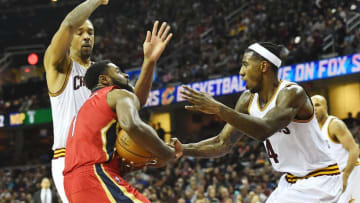 Jan 2, 2017; Cleveland, OH, USA; New Orleans Pelicans guard Tyreke Evans (1) drives to the basket against Cleveland Cavaliers forward Channing Frye (8) and guard Iman Shumpert (4) during the first half at Quicken Loans Arena. Mandatory Credit: Ken Blaze-USA TODAY Sports