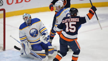 Mar 6, 2021; Uniondale, New York, USA; New York Islanders right wing Cal Clutterbuck (15) reacts after scoring a goal against Buffalo Sabres goalie Carter Hutton (40) during the second period at Nassau Veterans Memorial Coliseum. Mandatory Credit: Brad Penner-USA TODAY Sports