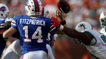 Dec 23, 2012; Miami Gardens, FL, USA; in the second half at Sun Life Stadium. Miami Dolphins defensive end Cameron Wake (91) hits Buffalo Bills quarterback Ryan Fitzpatrick (14) causing a fumble recovered by the Dolphins. Mandatory Credit: Miami won 24-10. Robert Mayer-USA TODAY Sports