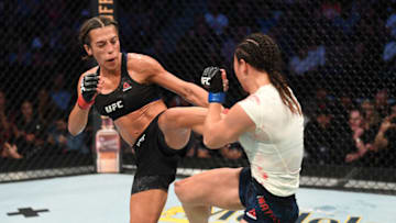 TAMPA, FLORIDA - OCTOBER 12: (L-R) Joanna Jedrzejczyk of Poland kicks Michelle Waterson in their women's strawweight bout during the UFC Fight Night event at Amalie Arena on October 12, 2019 in Tampa, Florida. (Photo by Josh Hedges/Zuffa LLC via Getty Images)