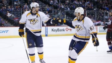 Dec 9, 2014; Denver, CO, USA; Nashville Predators left wing James Neal (left) celebrates with Nashville Predators center Mike Ribeiro (63) after scoring a goal during the third period at the at Pepsi Center. The Predators won 3-0. Mandatory Credit: Chris Humphreys-USA TODAY Sports