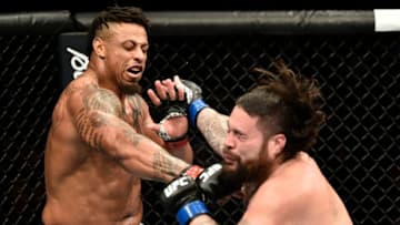 BOSTON, MASSACHUSETTS - OCTOBER 18: (L-R) Greg Hardy punches Ben Sosoli in their heavyweight bout during the UFC Fight Night event at TD Garden on October 18, 2019 in Boston, Massachusetts. (Photo by Chris Unger/Zuffa LLC via Getty Images)