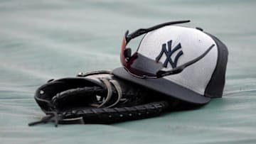 Aug 29, 2016; Kansas City, MO, USA; A New York Yankees hat & glove sit on the field before the game against the Kansas City Royals at Kauffman Stadium. Mandatory Credit: John Rieger-USA TODAY Sports