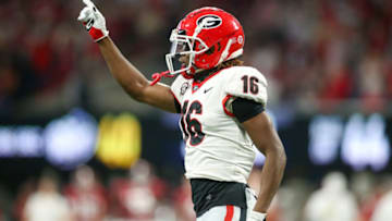 2022 NFL Draft; Georgia Bulldogs defensive back Lewis Cine (16) celebrates after a pass break-up against the Alabama Crimson Tide in the first half during the SEC championship game at Mercedes-Benz Stadium. Mandatory Credit: Brett Davis-USA TODAY Sports