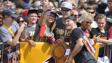 Jun 22, 2016; Cleveland, OH, USA; UFC heavyweight champion Stipe Miocic poses with fans prior to the Cleveland Cavaliers NBA championship parade in downtown Cleveland. Mandatory Credit: David Richard-USA TODAY Sports