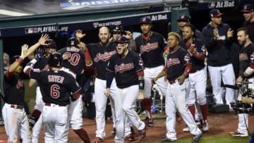Nov 2, 2016; Cleveland, OH, USA; Cleveland Indians center fielder Rajai Davis (20) celebrates with teammates after hitting a two-run home run against the Chicago Cubs in the 8th inning in game seven of the 2016 World Series at Progressive Field. Mandatory Credit: David Richard-USA TODAY Sports