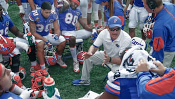 Jan 1, 2016; Orlando, FL, USA; Florida Gators offensive line coach Mike Summers (right center) talks to his players during the second half against the Michigan Wolverines in the 2016 Citrus Bowl at Orlando Citrus Bowl Stadium. Michigan won 41-7. Mandatory Credit: Reinhold Matay-USA TODAY Sports