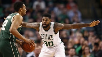 Feb 25, 2016; Boston, MA, USA; Boston Celtics forward Amir Johnson (90) defends against Milwaukee Bucks forward Jabari Parker (12) during the second half at TD Garden. Mandatory Credit: Mark L. Baer-USA TODAY Sports