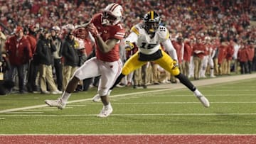 MADISON, WI - NOVEMBER 11: Bradrick Shaw #7 of the Wisconsin Badgers avoids a tackle by Joshua Jackson #15 of the Iowa Hawkeyes during the fourth quarter of a game at Camp Randall Stadium on November 11, 2017 in Madison, Wisconsin. (Photo by Stacy Revere/Getty Images)
