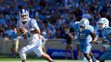 CHAPEL HILL, NC - SEPTEMBER 23: Daniel Jones #17 of the Duke Blue Devils rolls out against the North Carolina Tar Heels during their game at Kenan Stadium on September 23, 2017 in Chapel Hill, North Carolina. (Photo by Grant Halverson/Getty Images)