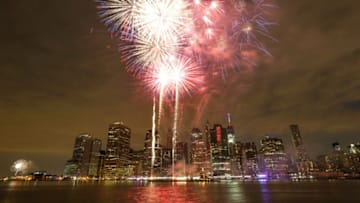NEW YORK, USA - JULY 04: Fireworks illuminate the sky over the East River during the 39th annual Macy's 4th of July fireworks in New York City, on July 04, 2015. (Photo by Cem Ozdel/Anadolu Agency/Getty Images)