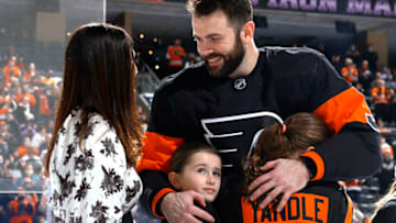 PHILADELPHIA, PENNSYLVANIA - JANUARY 29: Keith Yandle #3 of the Philadelphia Flyers celebrates with family after being honored for breaking the NHL’s ‘Iron Man’ record for most consecutive game streak prior to playing the Los Angeles Kings at Wells Fargo Center on January 29, 2022 in Philadelphia, Pennsylvania. (Photo by Tim Nwachukwu/Getty Images)