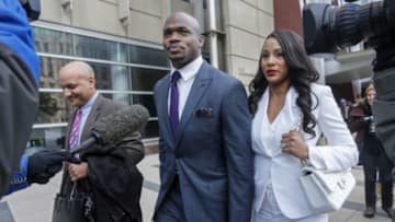Feb 6, 2015; Minneapolis, MN, USA; Minnesota Vikings running back Adrian Peterson leaves the U.S. District Courthouse with his wife Ashley Brown Peterson as the NFL Players Association's lawsuit against the NFL on behalf of Peterson is scheduled to reach federal court. Mandatory Credit: Bruce Kluckhohn-USA TODAY Sports