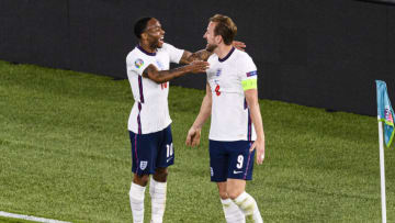 Harry Kane of England celebrates with his teammate Raheem Sterling (L) . (Photo by Marcio Machado/Eurasia Sport Images/Getty Images)